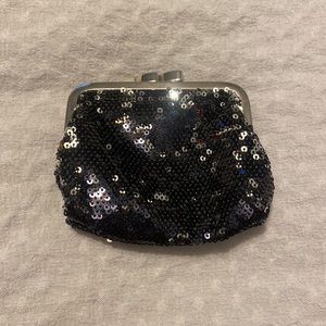 Tiny (fits in palm), black, silver, sequin, coin purse from Victoria's Secret.